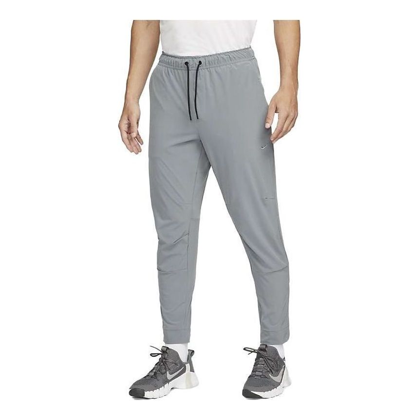 Joggingbukser Nike Zippered Cuff Versatile Training Pants Grå | FB7549-084, 0