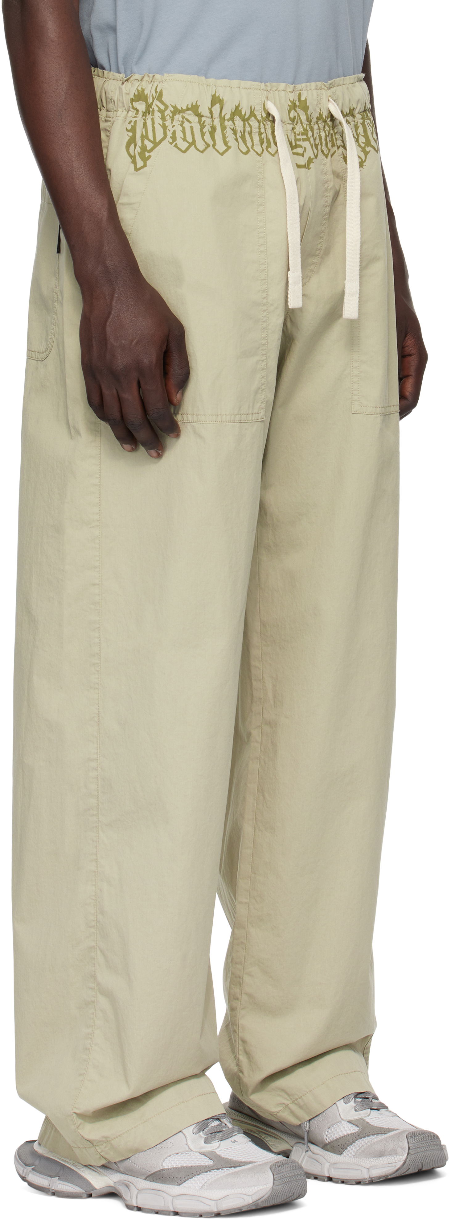 Cargo bukser Palm Angels Loose-Fit Cargo Pants With Logo Waistband Beige | PMCA117S25FAB0026156, 1