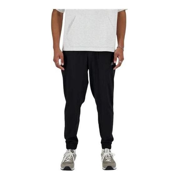 Joggingbukser New Balance Sport Essentials Woven Joggers Sort | MP41011-BK
