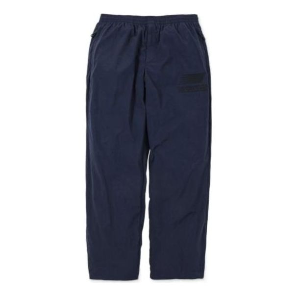 Joggingbukser New Balance N.HOOLYWOOD x INVINCIBLE(R) Woven Pants Blå | AMP22346-PCT